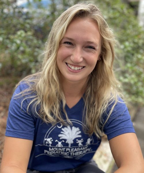Smiling person in a blue t-shirt.