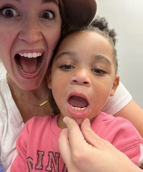 Woman and child making surprised faces together.
